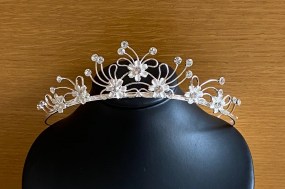 Silver and diamante tiara with ivory flower